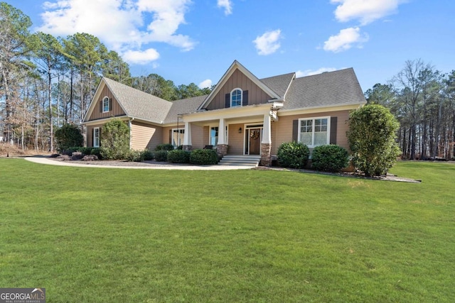 craftsman-style house with a front yard and covered porch