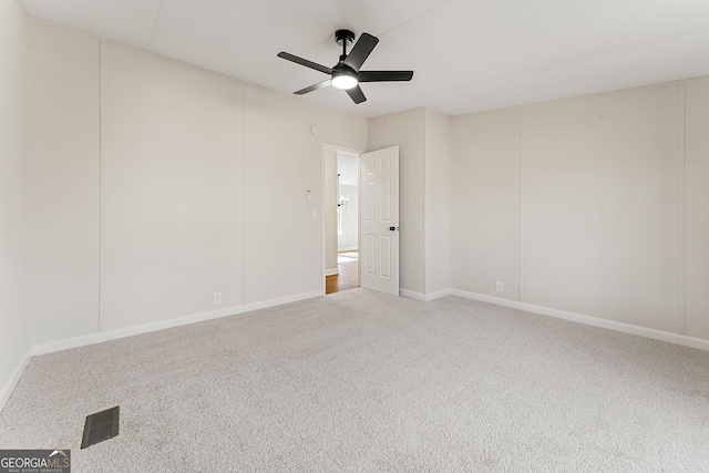 carpeted empty room with ceiling fan