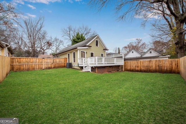 view of yard featuring a wooden deck and cooling unit