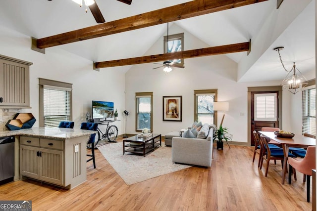 living room featuring ceiling fan with notable chandelier, high vaulted ceiling, beamed ceiling, and light wood-type flooring