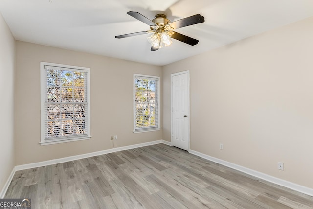 unfurnished bedroom with ceiling fan and light hardwood / wood-style flooring