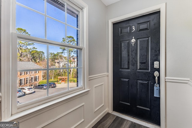 entrance foyer with dark hardwood / wood-style floors