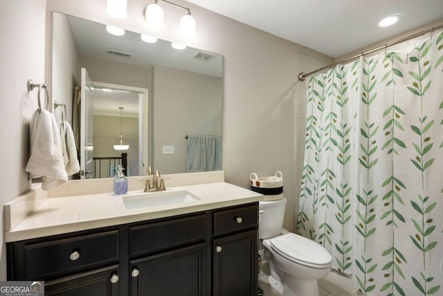 bathroom with toilet, a shower with shower curtain, and vanity