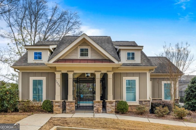 craftsman inspired home featuring covered porch