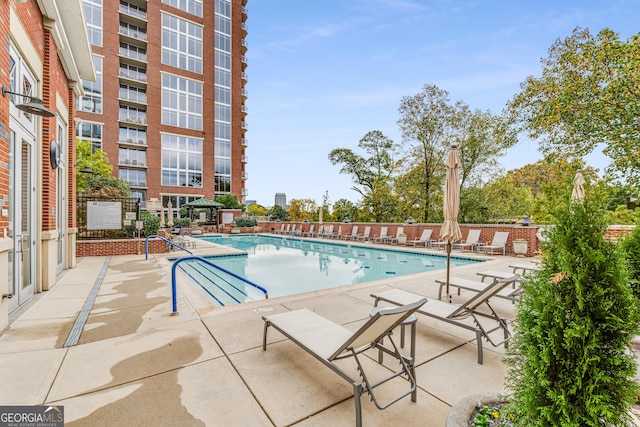 view of swimming pool with a patio