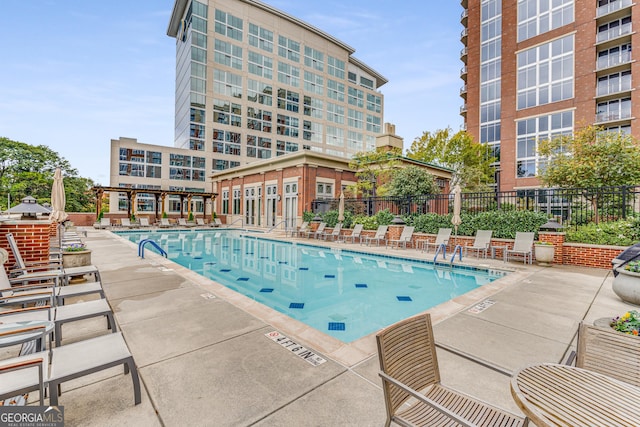 view of pool with a pergola and a patio area