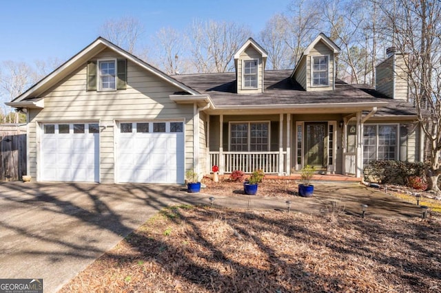 view of front of house with covered porch and a garage