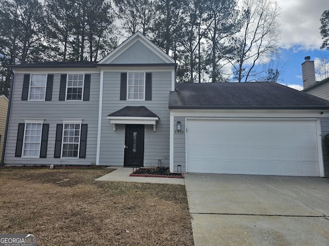 front facade with a garage