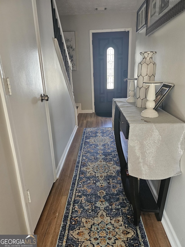 foyer featuring dark hardwood / wood-style floors