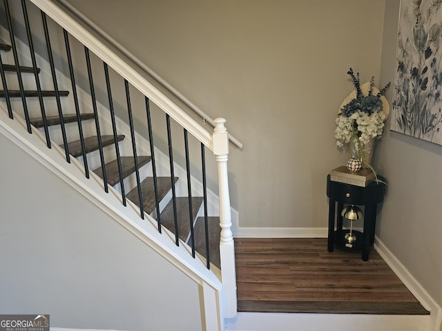 staircase featuring hardwood / wood-style floors