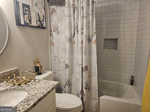 full bathroom featuring vanity, shower / tub combo, and toilet