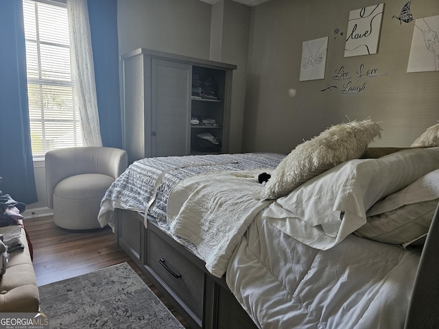 bedroom featuring dark hardwood / wood-style floors