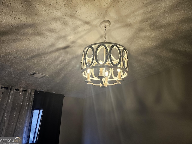 interior details featuring a textured ceiling