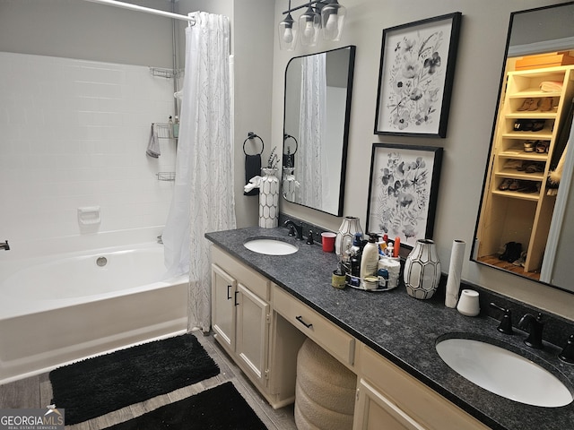 bathroom featuring vanity and shower / bath combo