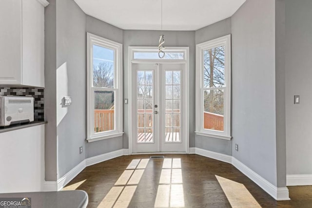 1331 Dayspring Trce, Lawrenceville, GA 30045 - doorway featuring dark hardwood / wood-style flooring, plenty of natural light, and french doors