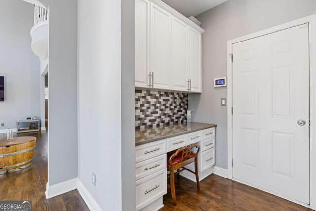 1331 Dayspring Trce, Lawrenceville, GA 30045 - interior space with dark wood-type flooring and built in desk