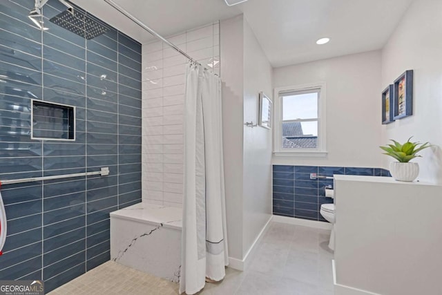 1331 Dayspring Trce, Lawrenceville, GA 30045 - bathroom featuring tile patterned flooring, toilet, tile walls, and walk in shower