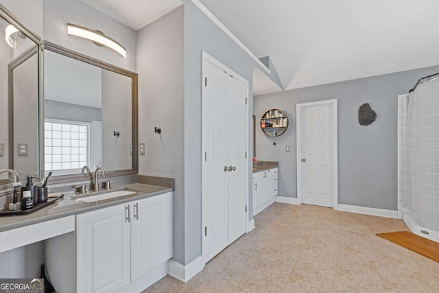 1331 Dayspring Trce, Lawrenceville, GA 30045 - bathroom with vaulted ceiling, vanity, tile patterned flooring, and a shower with shower curtain