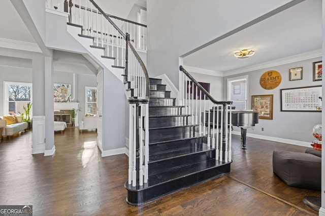 1331 Dayspring Trce, Lawrenceville, GA 30045 - stairs featuring hardwood / wood-style flooring, crown molding, and a high ceiling