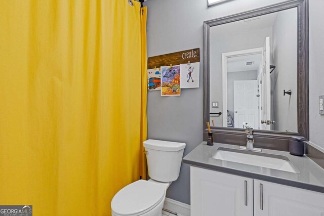 1331 Dayspring Trce, Lawrenceville, GA 30045 - bathroom featuring vanity and toilet