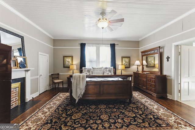 bedroom with a fireplace with flush hearth, crown molding, ceiling fan, and wood finished floors