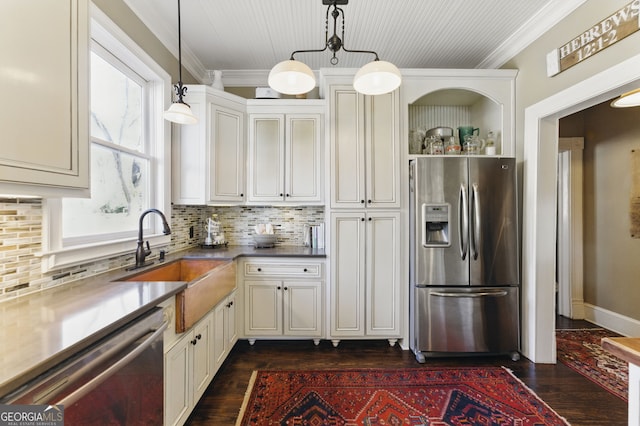 kitchen with appliances with stainless steel finishes, ornamental molding, dark wood-style flooring, a sink, and backsplash