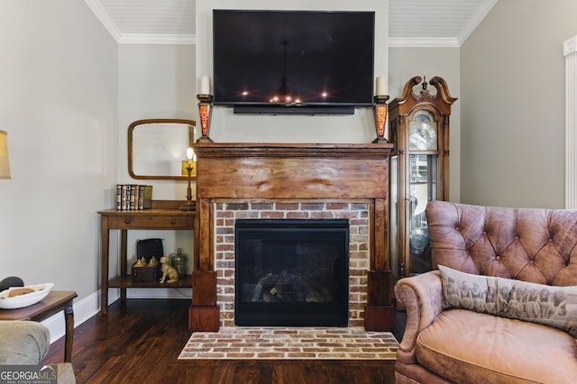 living area with dark wood-style floors, a fireplace, baseboards, and crown molding