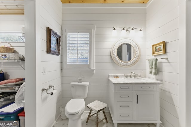 bathroom featuring toilet and vanity