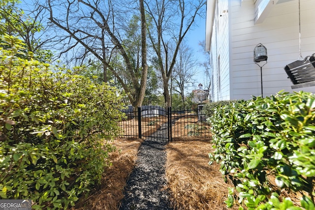 view of gate featuring fence