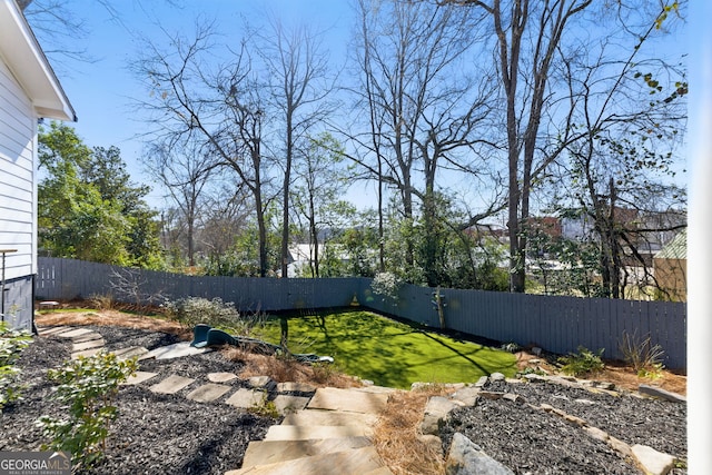 view of yard with a fenced backyard