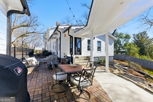 view of patio / terrace featuring outdoor dining space and fence