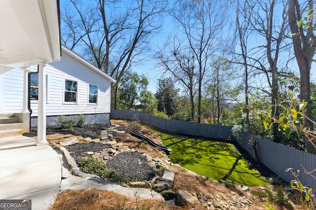 view of yard featuring a fenced backyard