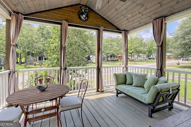 sunroom with vaulted ceiling and wooden ceiling