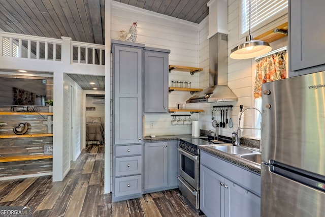 kitchen with sink, appliances with stainless steel finishes, island exhaust hood, dark hardwood / wood-style flooring, and wooden ceiling