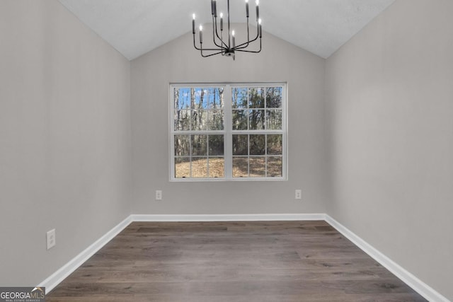 unfurnished living room with vaulted ceiling, dark hardwood / wood-style floors, and ceiling fan