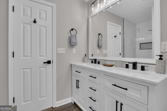 bathroom featuring vanity, toilet, and hardwood / wood-style floors