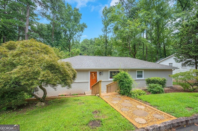 ranch-style house with a front lawn