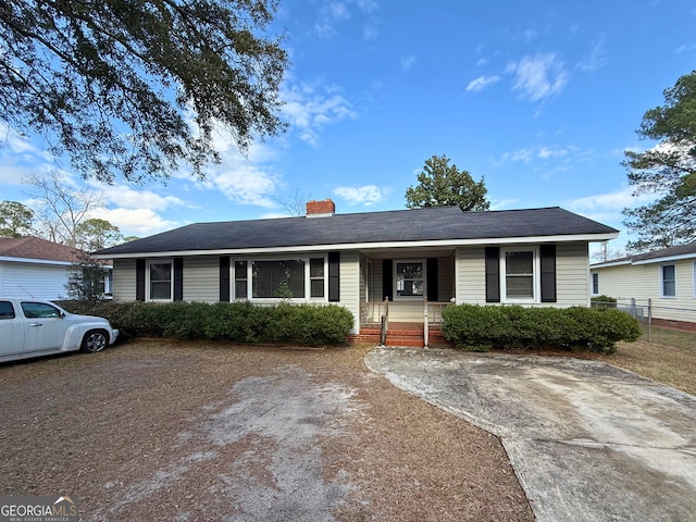 single story home featuring a porch