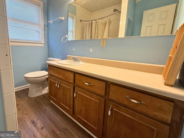 bathroom featuring walk in shower, wood-type flooring, toilet, and vanity