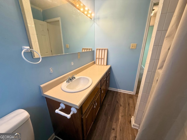 bathroom with vanity, hardwood / wood-style flooring, toilet, and a shower with shower curtain