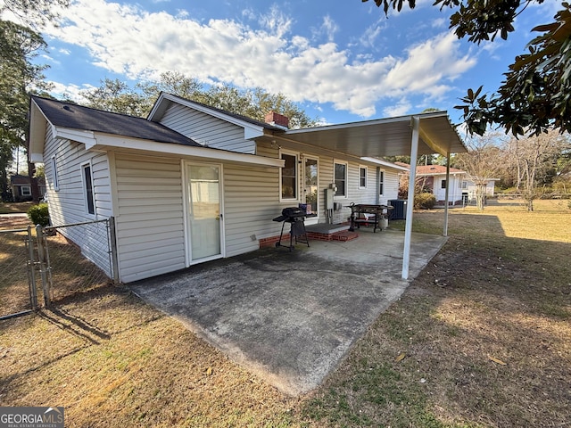 rear view of house with cooling unit and a patio area