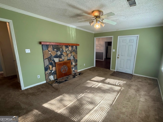 unfurnished living room with ornamental molding, a textured ceiling, and a fireplace