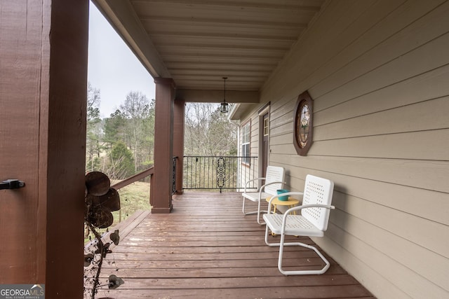 wooden deck featuring covered porch