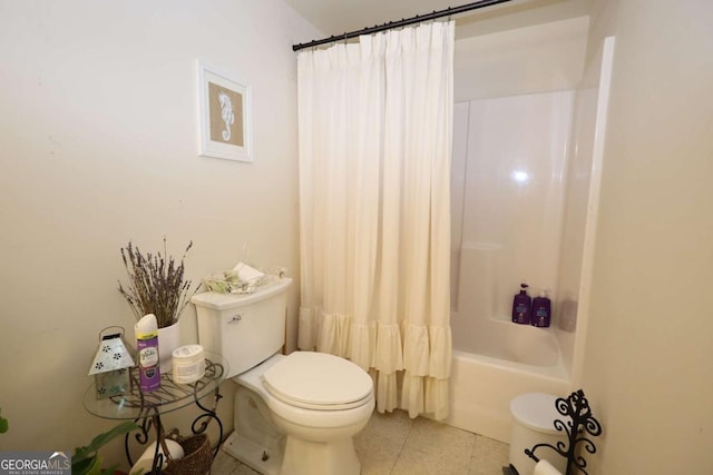 bathroom featuring shower / bathtub combination with curtain, tile patterned floors, and toilet