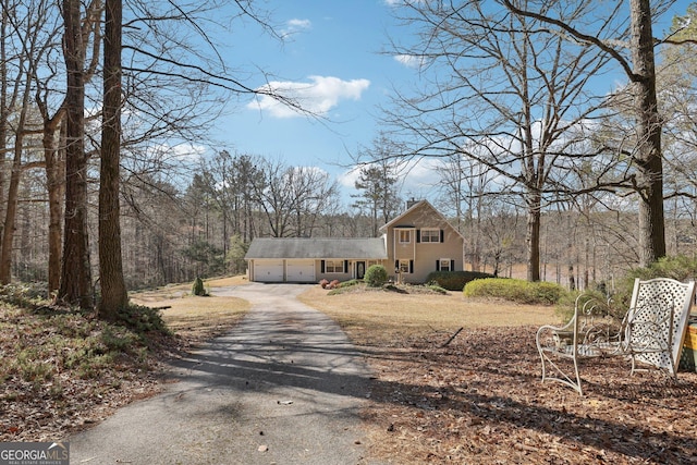 view of front of house with a garage and driveway