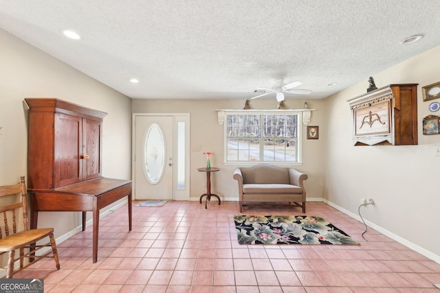 foyer with light tile patterned floors, recessed lighting, ceiling fan, a textured ceiling, and baseboards