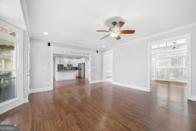 unfurnished living room with dark wood-style flooring, recessed lighting, ornamental molding, a ceiling fan, and baseboards