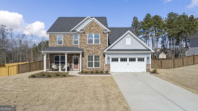 view of front of property featuring a garage and a front lawn