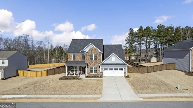 front facade with a garage and a porch