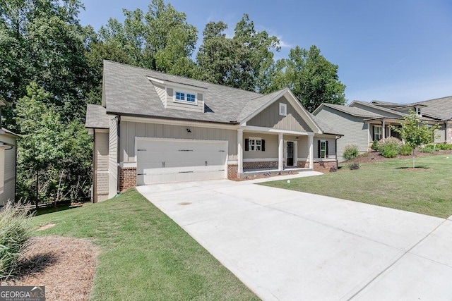 craftsman-style house featuring a porch, a garage, and a front lawn